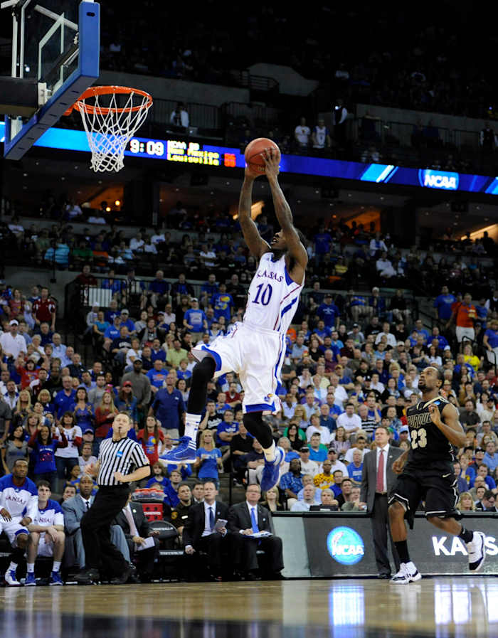 Mar 18, 2012; Omaha, NE, USA; Kansas Jayhawks guard Tyshawn Taylor (10) drives in for a dunk past Purdue Boilermakers guard Lewis Jackson (23) during the second half in the third round of the 2012 NCAA men's basketball tournament at the CenturyLink Center. Kansas defeated Purdue 63-60. Mandatory Credit: Peter G. Aiken-USA TODAY Sports